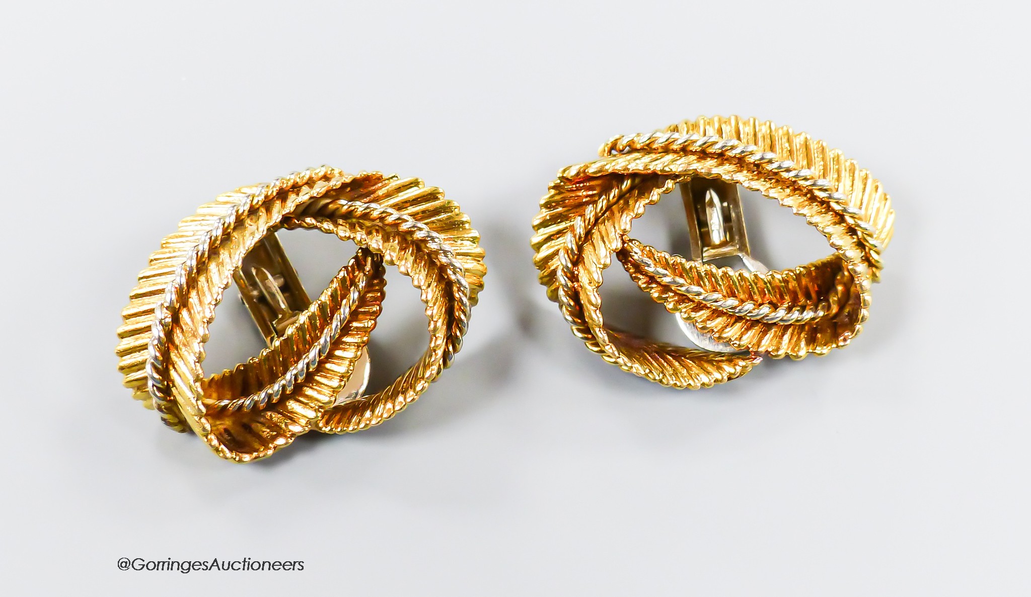 A pair of textured 750 yellow metal 'fern knot' ear clips, 27mm, 16.8 grams.